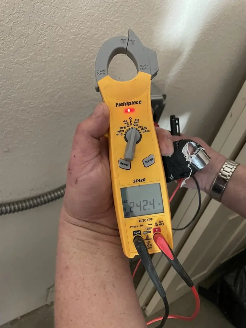 Voltage testing with clamp meter during Circuit Breaker Repair in Bethel
